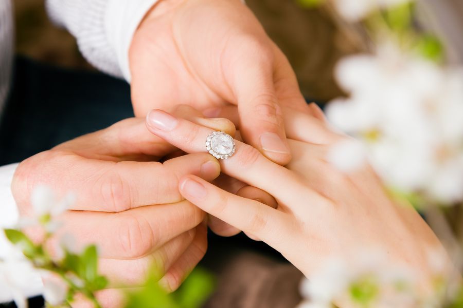 putting on the engagement ring