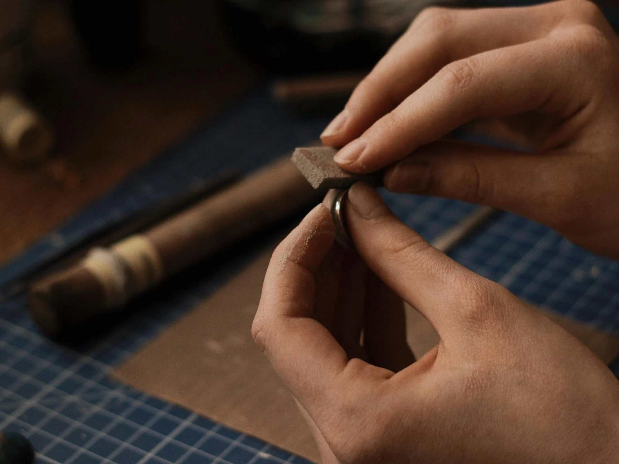 jeweler resizing a ring