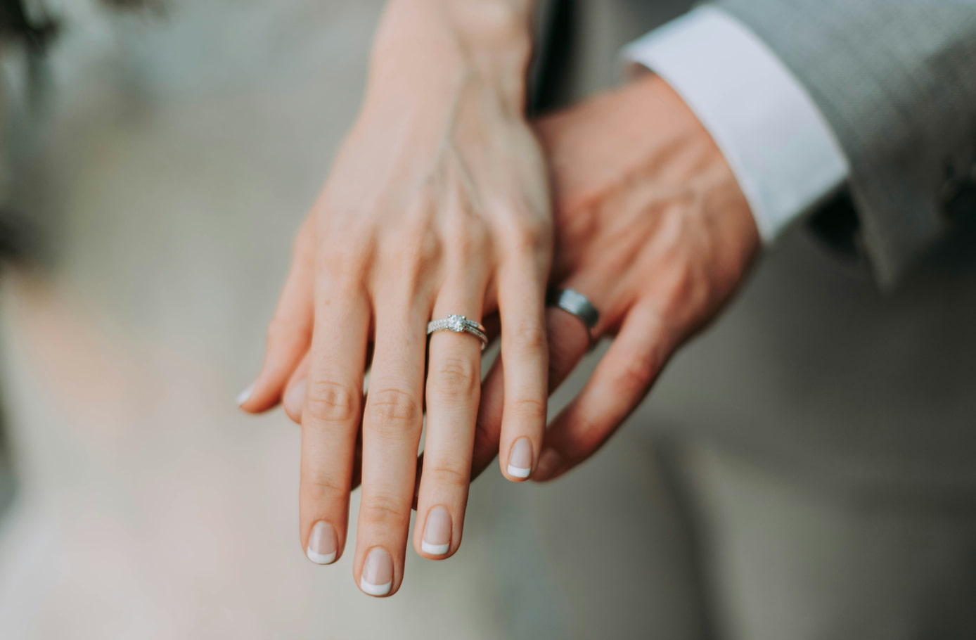 couple wearing wedding rings