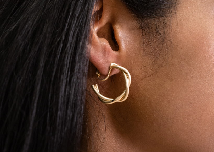 woman wearing clip on earrings