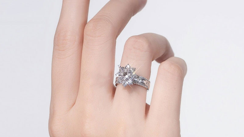 a diamond ring on a finger